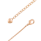 Close-up of the delicate gold heart charm detail on the bracelet extender chain