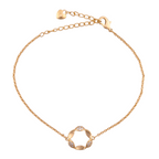 18k gold bracelet with a pavé floral circle charm on a white background