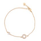 18k gold bracelet with a pavé circle charm and a solitaire accent on a white background