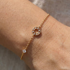 Circle charm bracelet worn on the wrist