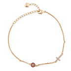 18k gold bracelet with evil eye charm and pavé cross on a white background