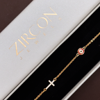 Evil eye and cross charm bracelet in a Zircon Jewels gift box