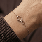 Infinity charm bracelet worn on wrist