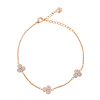 Gold-plated bracelet with pavé flower cluster accents on a white background