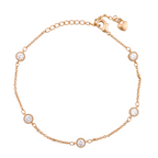 Gold-plated bracelet with round bezel-set stone accents on a white background