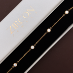 Bezel-set stone bracelet displayed in Zircon Jewels gift box
