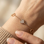 Heart charm bracelet with pavé centre worn on wrist