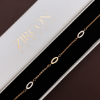Gold pavé oval bracelet displayed in Zircon Jewels gift box