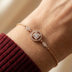 Gold halo stone bracelet worn on wrist