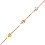 Delicate chain bracelet with two pavé heart charms on a white background