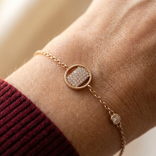 Gold round pavé bracelet worn on wrist