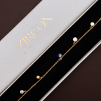 Gold-plated evil eye bracelet displayed in Zircon Jewels gift box