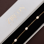 Gold oval stone bracelet displayed in Zircon Jewels gift box