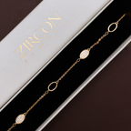 Gold-plated oval bracelet displayed in Zircon Jewels gift box