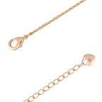Lobster clasp detail on gold-plated charm bracelet on a white background