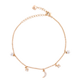 18K gold-plated celestial charm bracelet with crescent moon and star accents on a white background