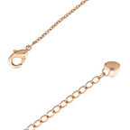 Lobster clasp and adjustable chain on gold-plated heart bracelet on a white background