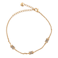 18K gold-plated bracelet with three micro-pavé cylindrical barrel charms on a white background