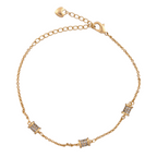 18K gold-plated bracelet with three micro-pavé cylindrical barrel charms on a white background