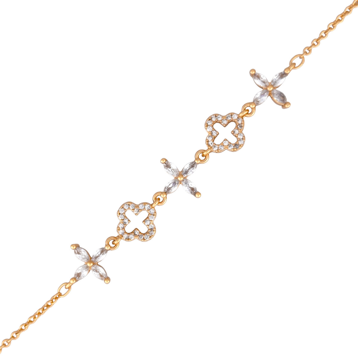 Gold bracelet with clover and floral designs on a white background