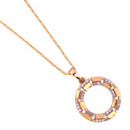 Close-up of the circle pendant with pavé and enamel detail