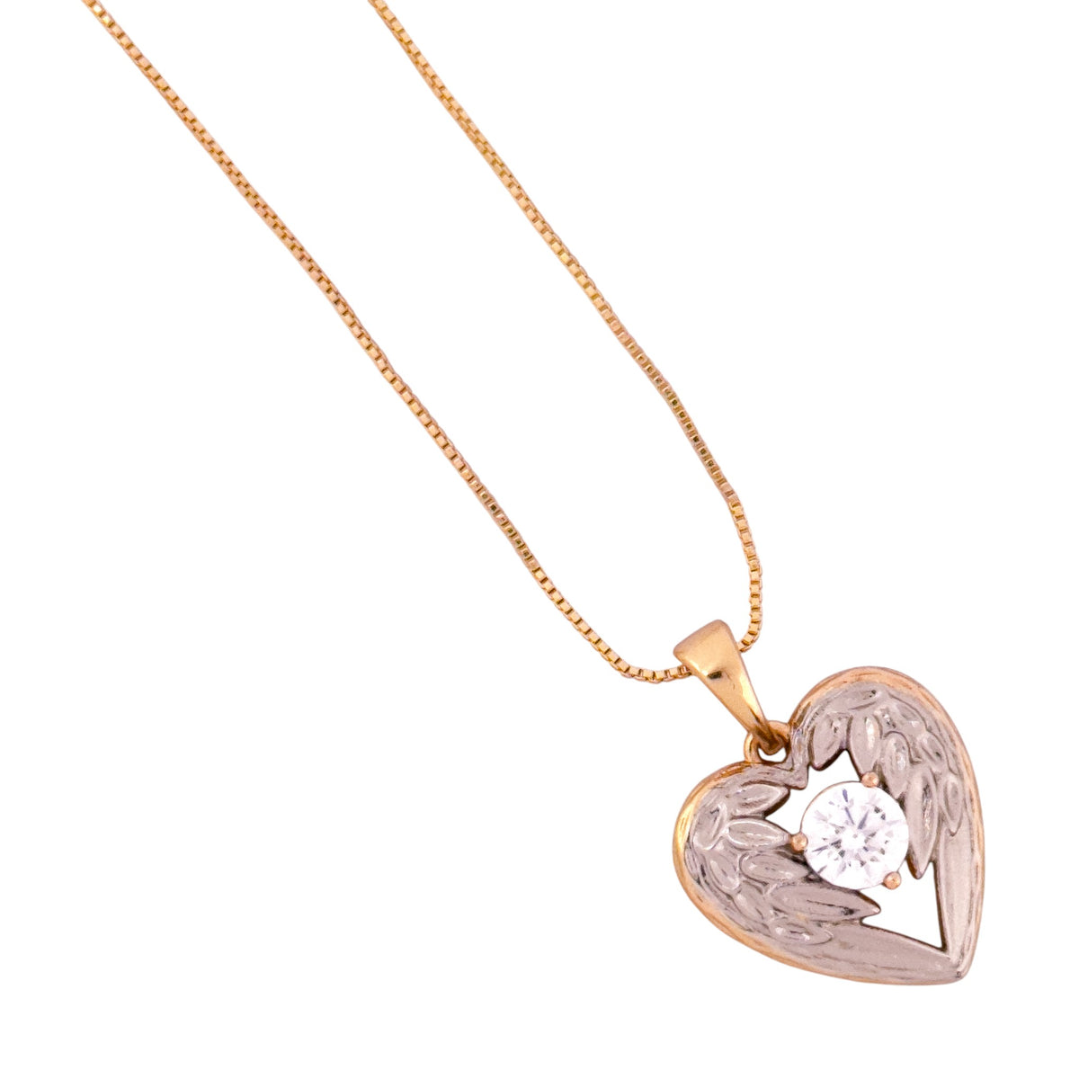 Close-up of the winged heart pendant and solitaire stone detail