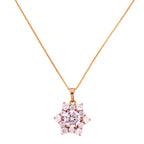 Gold-plated floral cluster pendant necklace with clear stones on a white background