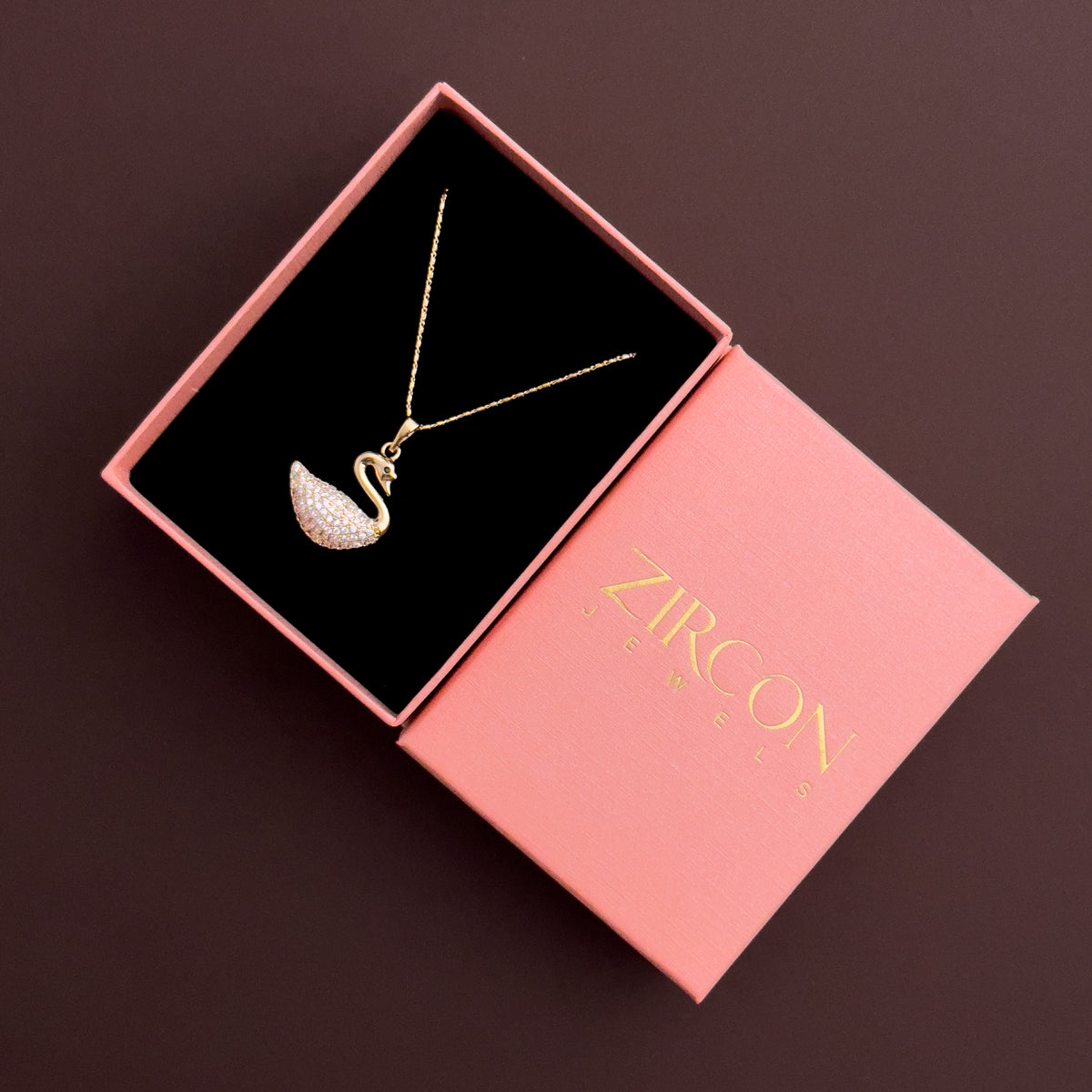 Swan-shaped clear stone pendant necklace in a Zircon Jewels gift box