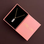 Vertical three-stone halo pendant necklace in a Zircon Jewels gift box