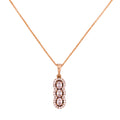 Gold-plated necklace with a vertical pendant featuring three stones surrounded by a clear stone halo on a white background
