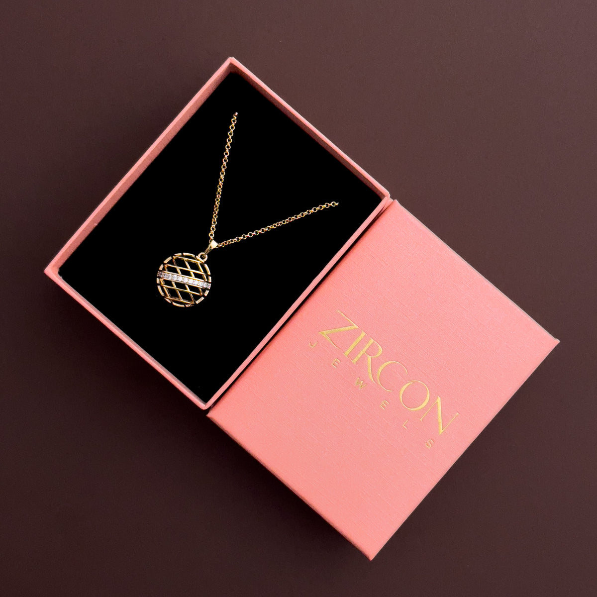 Round open-grid pendant necklace in a Zircon Jewels gift box