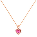 Gold-plated necklace with a heart-shaped pink gemstone pendant on a white background
