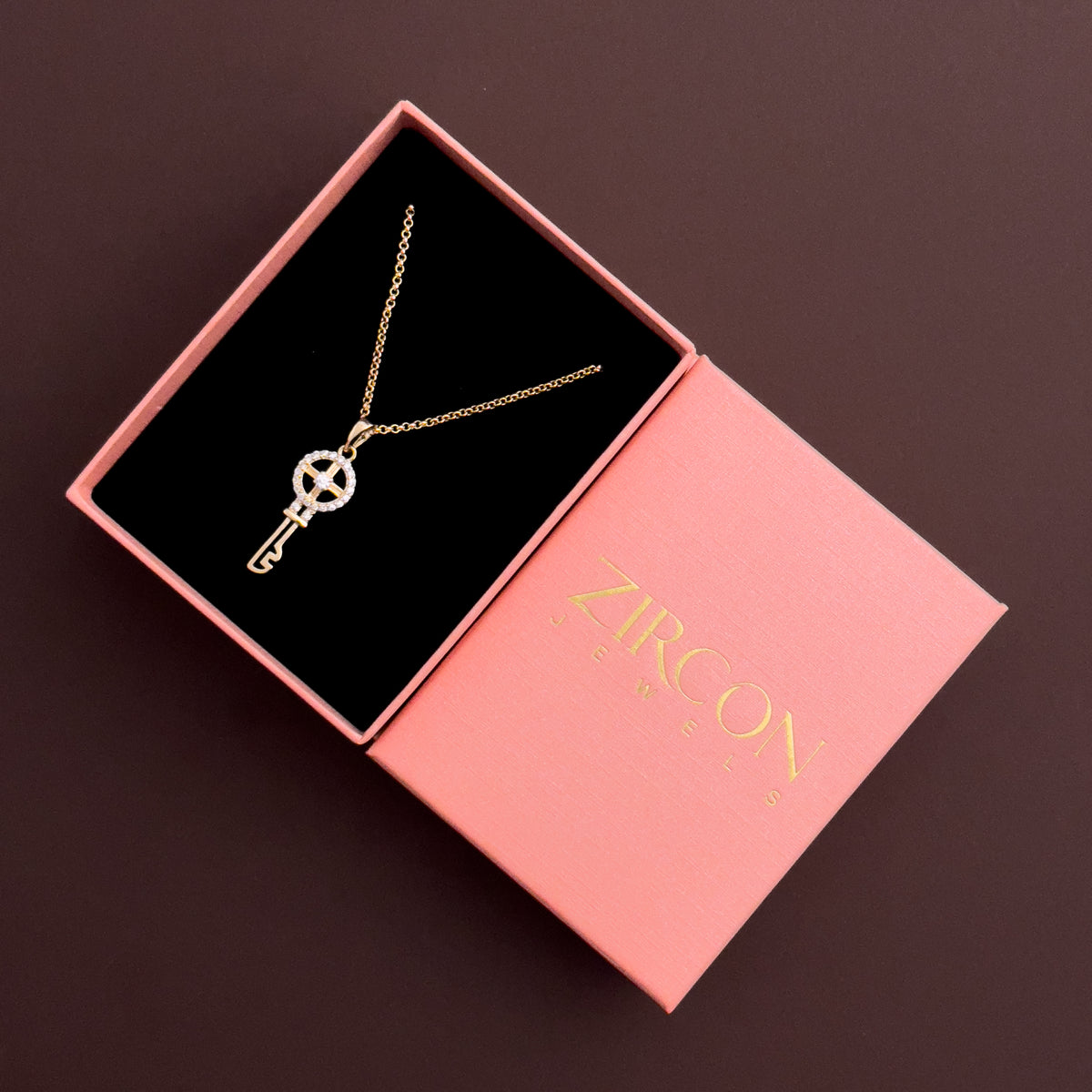 Key pendant necklace placed in a Zircon Jewels gift box
