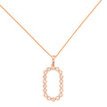 Gold-plated necklace with an oval pavé link pendant on a white background