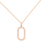 Gold-plated necklace with an oval pavé link pendant on a white background
