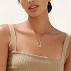 Oval pavé pendant necklace worn on the neck