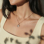 Geometric pendant necklace worn on the neck