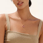 Red evil eye pendant necklace worn on the neck