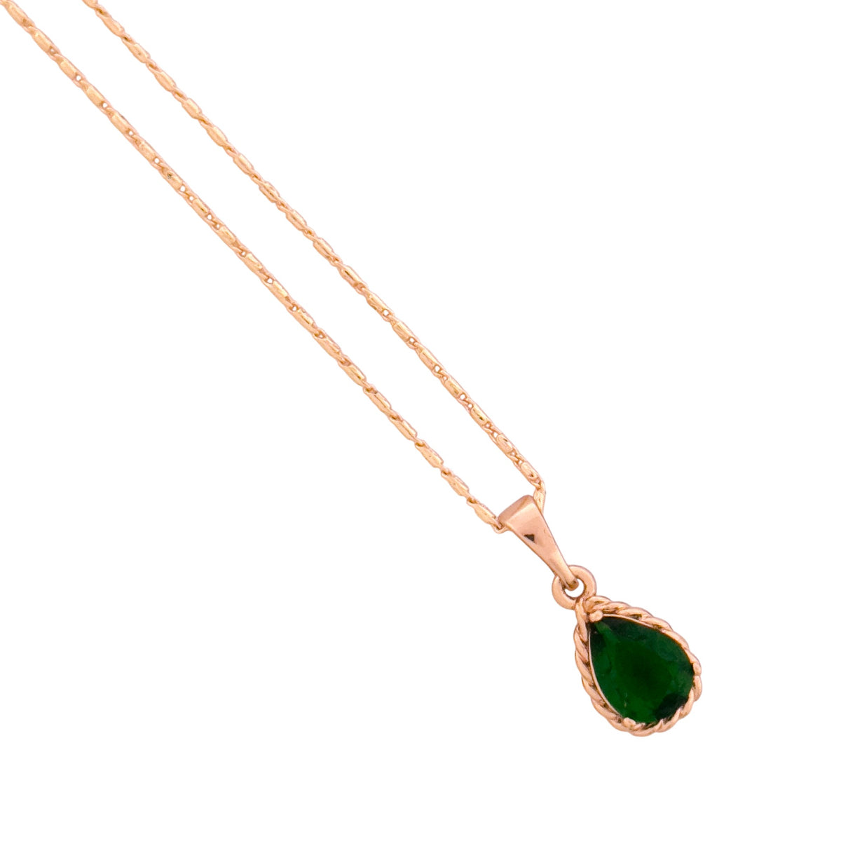 Close-up of the emerald green teardrop pendant detail