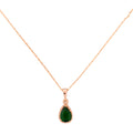 Necklace with a green teardrop pendant on a white background