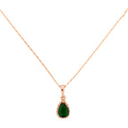 Necklace with a green teardrop pendant on a white background
