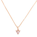 Gold-plated triangle pendant necklace with pavé detailing on a white background