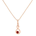 Gold-plated infinity drop pendant necklace with a red gemstone accent on a white background