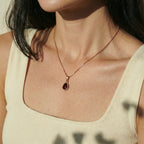 Teardrop pendant necklace worn on the neck