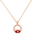 Gold-plated red enamel evil eye pendant necklace with lash detailing on a white background