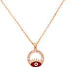 Gold-plated red enamel evil eye pendant necklace with lash detailing on a white background