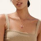 Red evil eye pendant necklace worn on the neck