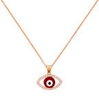 Gold-plated red evil eye pendant necklace with a pavé border on a white background