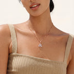 Triangle pendant necklace worn on the neck