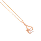 Close-up of the teardrop pendant and three-stone detail